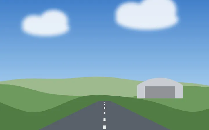 Start- und Landebahn mit Hangar am Flugplatz